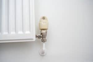 white radiator valve that needs replacing