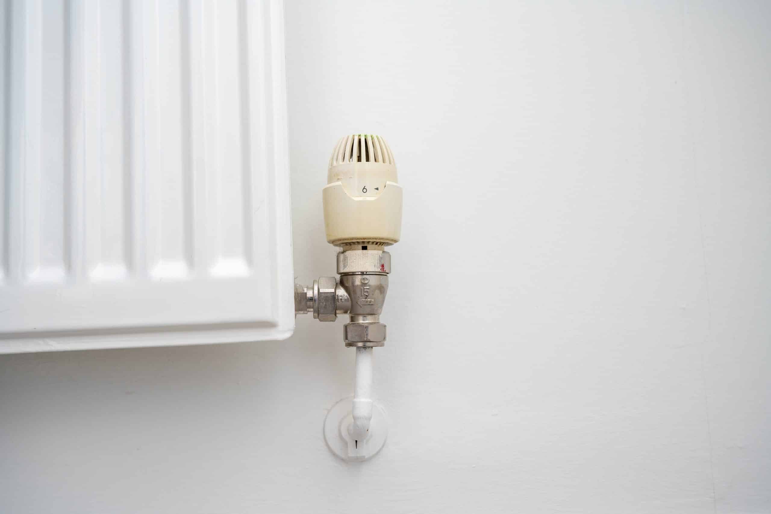 white radiator valve that needs replacing